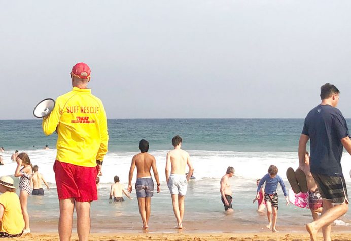 Surf lifesaver between flags