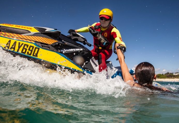 Lifesaver on a jet ski rescuing someone