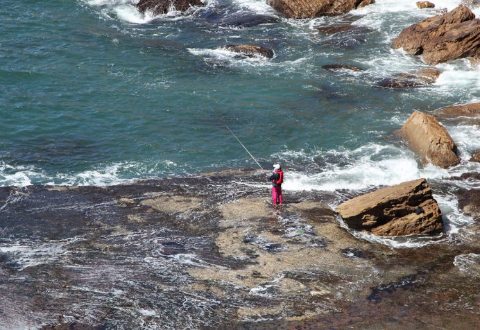 Person rock fishing