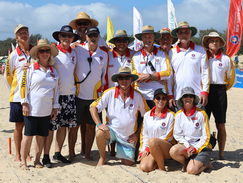 Group of officials on the beach