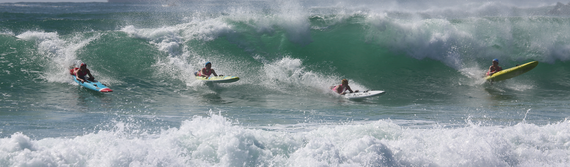 Athletes competing in a board race