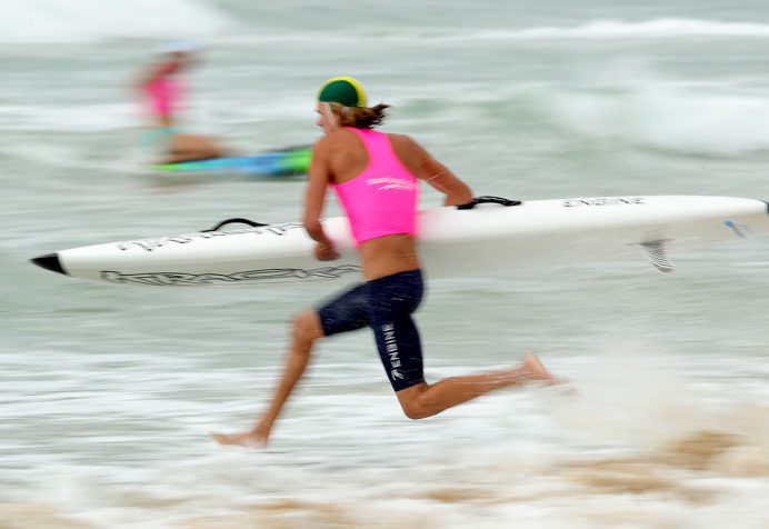 Athlete running into the water