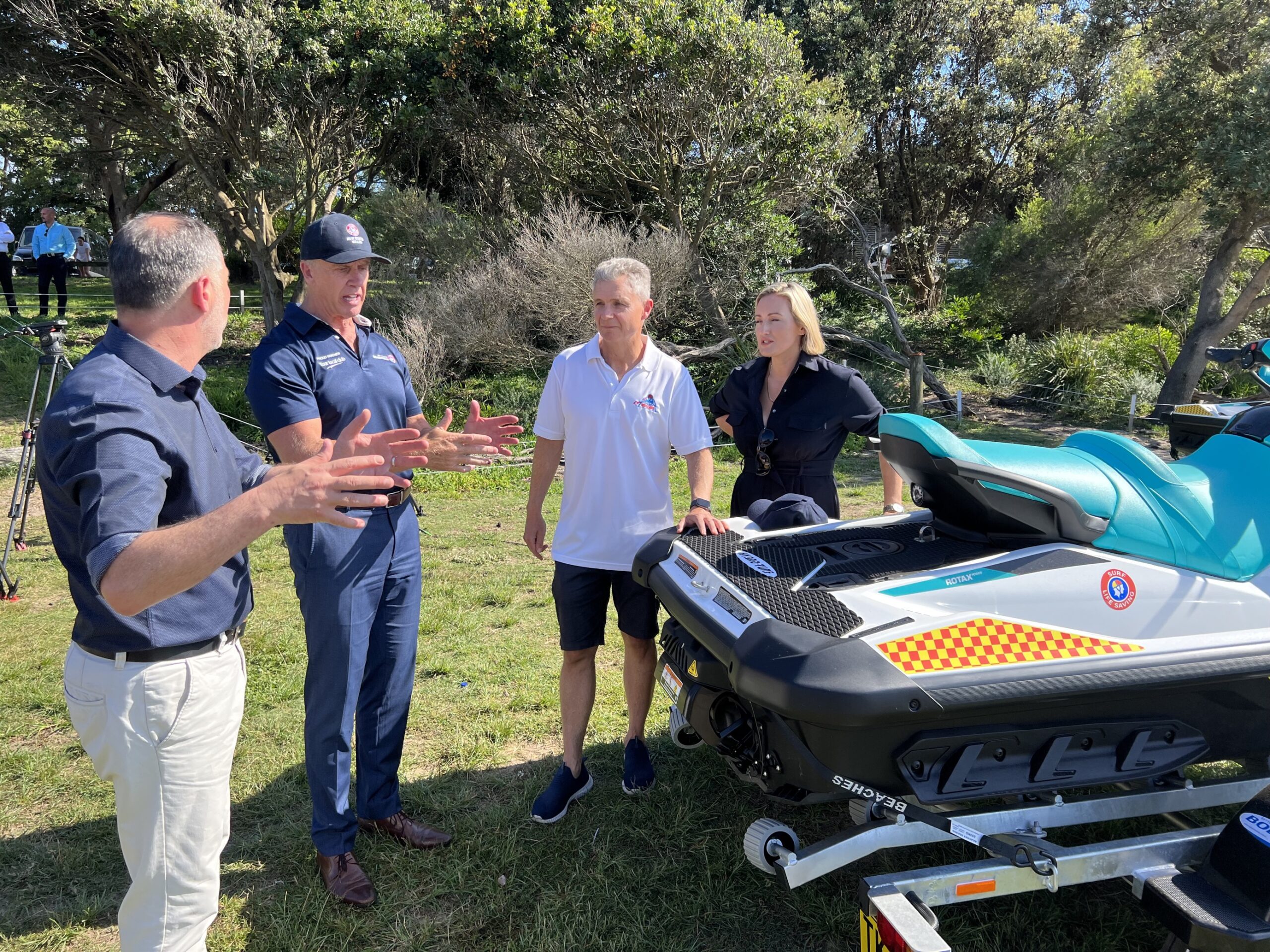 Minister for Emergency Services Jihad Dib2, Member for Coogee Dr Marjorie O’Neill, Federal Member for Kingsford Smith Matt Thistlethwaite and SLSNSW CEO Steve Pearce talking around jetski