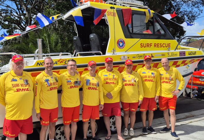 SR30 Skippers standing in front of new rescue vessel